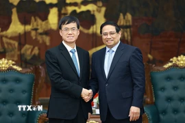 Thủ tướng Phạm Minh Chính tiếp ông Bùi Kim Giai, Bộ trưởng Bộ Công tác Quân nhân xuất ngũ Trung Quốc. (Ảnh: Dương Giang/TTXVN)