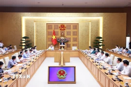 Thủ tướng Phạm Minh Chính chủ trì họp đánh giá sơ kết 1 tháng vận hành chính quyền địa phương hai cấp. (Ảnh: Dương Giang/TTXVN)