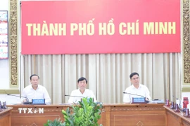 Ông Võ Văn Minh, Chủ tịch Hội đồng Nhân dân Thành phố Hồ Chí Minh, Chủ tịch Ủy ban Bầu cử Thành phố, chủ trì Hội nghị. (Ảnh: Hữu Duyên/TTXVN)