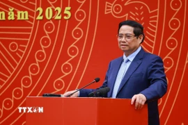 Thủ tướng Phạm Minh Chính chia sẻ với cộng đồng người Việt Nam tại Trung Quốc. (Ảnh: Dương Giang/TTXVN)