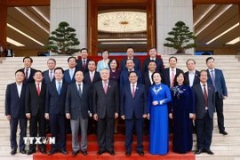 Thủ tướng Chính phủ Phạm Minh Chính và các Phó Thủ tướng Chính phủ, Bộ trưởng, thành viên Chính phủ nhiệm kỳ 2021-2026. (Ảnh: Dương Giang/TTXVN)