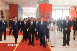 Lãnh đạo Đảng, Nhà nước đến dự họp báo và khai trương Trung tâm Báo chí Đại hội XIV. (Ảnh: Minh Quyết/TTXVN)