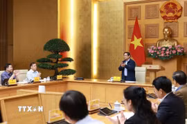 Thủ tướng Phạm Minh Chính chủ trì cuộc họp về phát triển sàn dữ liệu tại Việt Nam. (Ảnh: Dương Giang/TTXVN)