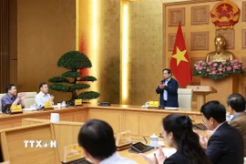 Thủ tướng Phạm Minh Chính chủ trì cuộc họp về phát triển sàn dữ liệu tại Việt Nam. (Ảnh: Dương Giang/TTXVN)