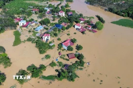 Nhiều thôn tại xã Bố Hạ vẫn ngập sâu trong nước. (Ảnh: Danh Lam/TTXVN)