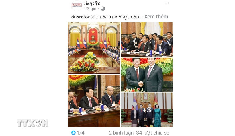 Bài viết Chủ tịch nước hai nước Việt Nam-Lào gặp song phương trên báo Pasaxon. (Ảnh: Xuân Tú/TTXVN)
