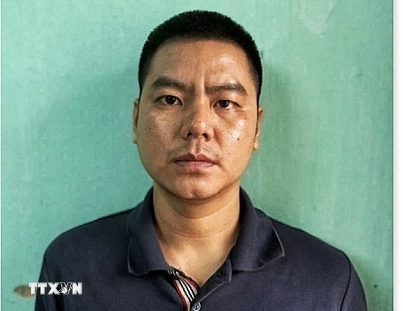 Đối tượng Lê Hữu Tuấn tại cơ quan điều tra. (Nguồn: TTXVN phát)