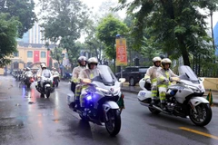 Lễ giễu hành, ra quân của các lực lượng, phương tiện của Công an thành phố Hà Nội. Ảnh: Phạm Kiên/TTXVN)