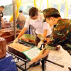 Thực hiện số hóa các thông tin về hài cốt Liệt sỹ chưa xác định được danh tính ngay tại chỗ. (Ảnh: Trần Trang/TTXVN)
