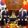 Tổng Bí thư, Chủ tịch nước Tô Lâm và Tổng thống Hàn Quốc Lee Jae Myung gặp hẹp. (Ảnh: Thống Nhất/TTXVN)