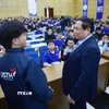 Thủ tướng Phạm Minh Chính truyền cảm hứng cho sinh viên Trường Đại Học Khoa Học Và Công Nghệ Hà Nội. (Ảnh: Dương Giang/TTXVN)