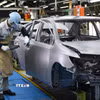 Công nhân làm việc tại một nhà máy của Toyota tại tỉnh Aichi, Nhật Bản. (Nguồn: AFP/TTXVN)