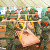 Các chiến sỹ di dời, cất bốc các phần mộ liệt sỹ chưa xác định được thông tin, nhằm phục vụ công tác giám định ADN tại Nghĩa trang Liệt sỹ Độc Lập. (Ảnh: Phan Quân/TTXVN)