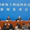 Người phát ngôn kỳ họp Lưu Kiệt Nhất (thứ hai, phải). (Nguồn: Xinhua)