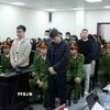 Các bị cáo tại phiên tòa xét xử. (Ảnh: Phạm Kiên/TTXVN)