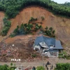 Hiện trường đống đổ nát sau vụ sạt lở đất. (Ảnh: Tuấn Anh/TTXVN)