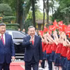 Thiếu nhi Hà Nội chào mừng Tổng Bí thư, Chủ tịch nước Trung Quốc Tập Cận Bình thăm cấp Nhà nước tới Việt Nam. (Ảnh: Thống Nhất/TTXVN)