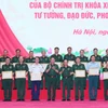 Đại tướng Phan Văn Giang, Bộ trưởng Bộ Quốc phòng và Thượng tướng Trịnh Văn Quyết, Chủ nhiệm Tổng cục Chính trị Quân đội Nhân dân Việt Nam trao Bằng khen của Bộ trưởng Quốc phòng tặng các cá nhân, tập thể. (Ảnh: Trọng Đức/TTXVN)