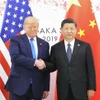 Tổng thống Mỹ Donald Trump trong cuộc gặp với Chủ tịch Trung Quốc Tập Cận Bình (phải) ngày 29/6/2019. (Ảnh: THX/TTXVN)