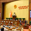 Quốc hội biểu quyết thông qua Luật Tương trợ tư pháp về dân sự. (Ảnh: Doãn Tấn/TTXVN)