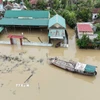 Nước sông Lam dâng cao khiến nhiều khu vực bị ngập, đường giao thông trong thôn Hồng Lam, Hà Tĩnh bị chia cắt cục bộ hồi đầu tháng 9. (Ảnh: Hữu Quyết/TTXVN)