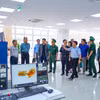 Đoàn công tác hai nước khảo sát hệ thống điều hành, giám sát tại khu vực cửa khẩu quốc tế Tân Nam, tỉnh Tây Ninh. (Ảnh: Minh Phú/TTXVN)