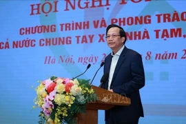Bộ trưởng Bộ Dân tộc và Tôn giáo Đào Ngọc Dung báo cáo tổng kết Chương trình và Phong trào thi đua “Cả nước chung tay xóa nhà tạm, nhà dột nát”. (Ảnh: Dương Giang/TTXVN)