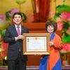 Anh hùng Lao động Thái Hương - Nhà Sáng lập Tập đoàn TH - đã đón nhận danh hiệu phong tặng từ Chủ tịch nước Lương Cường. (Ảnh: PV/Vietnam+)
