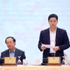 Thứ trưởng Thường trực Bộ Y tế Vũ Mạnh Hà trả lời các câu hỏi của nhà báo. (Ảnh: Văn Điệp/TTXVN)