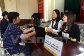 Tổ chức chi trả lương hưu. (Ảnh: PV/Vietnam+)