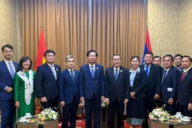 Cuộc gặp song phương giữa hai Bộ trưởng Lao động và Phúc lợi xã hội Lào Phosay Sayasone và Bộ trưởng Bộ Nội vụ Việt Nam Đỗ Thanh Bình. (Ảnh: BNV/Vietnam+)