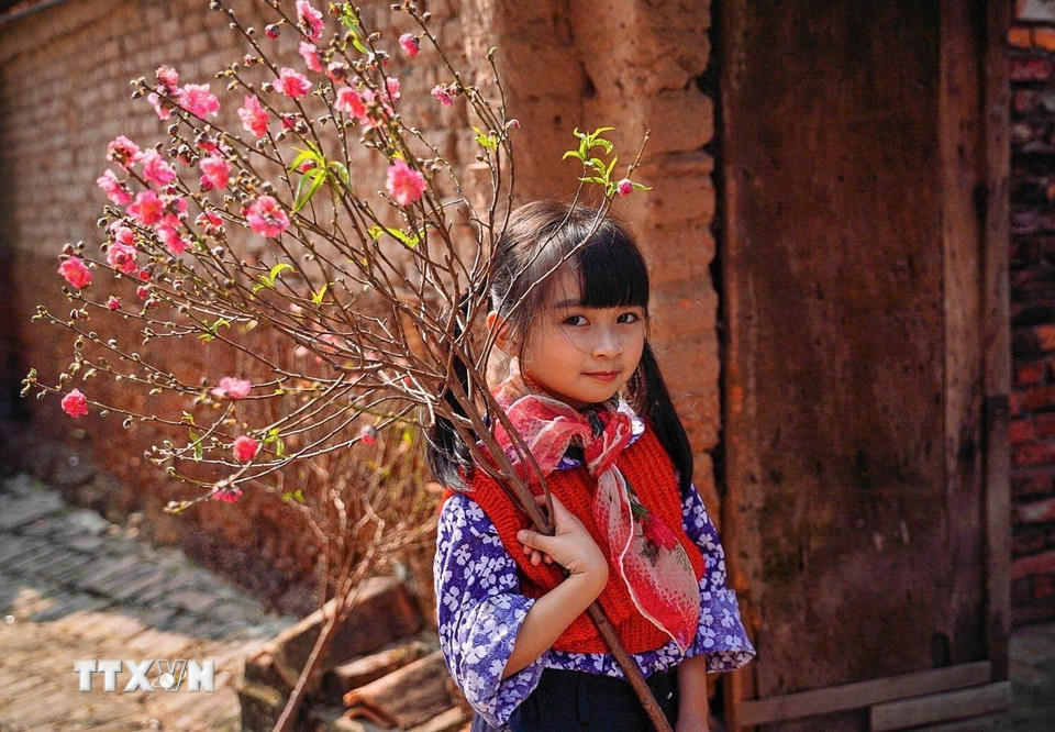 Tết là dịp trẻ nhỏ luôn háo hức mong chờ. (Ảnh: Khánh Hòa/TTXVN)