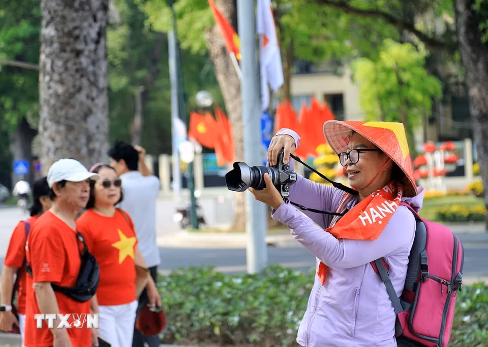 Lưu giữ những khoảnh khắc đẹp, ghi dấu ấn những ngày lịch sử của dân tộc. (Ảnh: Tuấn Anh/TTXVN)
