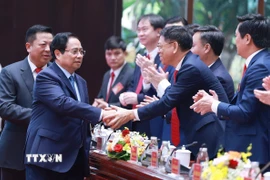 Thủ tướng Phạm Minh Chính với các đại biểu dự Đại hội đại biểu Đảng bộ Bộ Xây dựng nhiệm kỳ 2025-2030. (Ảnh: Dương Giang/TTXVN)