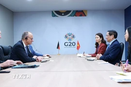 Thủ tướng Phạm Minh Chính gặp Thủ tướng Đức Friedrich Merz. (Ảnh: Dương Giang/TTXVN)