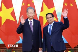 Thủ tướng Phạm Minh Chính hội kiến Ủy viên trưởng Nhân đại toàn quốc Trung Quốc Triệu Lạc Tế. (Ảnh: Dương Giang/TTXVN)