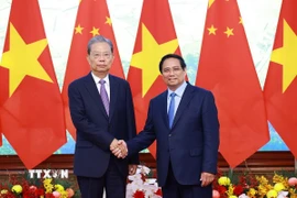Thủ tướng Phạm Minh Chính hội kiến Ủy viên trưởng Nhân đại Toàn quốc Trung Quốc Triệu Lạc Tế. (Ảnh: Dương Giang/TTXVN)