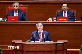 Đồng chí Nguyễn Mạnh Hùng, Phó Giám đốc Học viện Chính trị quốc gia Hồ Chí Minh, trình bày tham luận “Hoàn thiện lý luận về đường lối đổi mới của Đảng trong kỷ nguyên vươn mình của dân tộc”. (Ảnh: TTXVN)