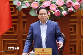 Thủ tướng Phạm Minh Chính chủ trì họp khắc phục hậu quả thiên tai sau bão. (Ảnh: Dương Giang/TTXVN)