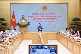 Phó Thủ tướng Hồ Quốc Dũng chủ trì Phiên họp Ban Chỉ đạo Quốc gia về chống khai thác IUU. (Ảnh: Tuấn Anh/TTXVN)