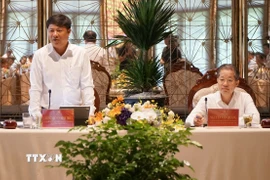 Bí thư Thành ủy Đà Nẵng Nguyễn Văn Quảng (bên phải) và Bí thư Tỉnh ủy Quảng Nam Lương Nguyễn Minh Triết (bên trái) chủ trì Hội nghị. (Ảnh: Quốc Dũng/ TTXVN)