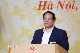 Thủ tướng Phạm Minh Chính chủ trì Hội nghị đánh giá 03 năm thực hiện Nghị quyết số 18-NQ/TW và 01 năm thi hành Luật Đất đai năm 2024. (Ảnh: Dương Giang/TTXVN)