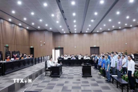 Ngành Nội chính Đảng, nhất là Ban Nội chính Trung ương - Cơ quan Thường trực của Ban Chỉ đạo Trung ương về phòng, chống tham nhũng trở thành chỗ dựa tin cậy vững chắc của Đảng trong tham mưu xây dựng đường lối, chính sách để không ai có thể tham nhũng; tham mưu, định hướng chỉ đạo giải quyết, xử lý, truy tố, điều tra, xét xử các vụ việc, vụ án lớn, phức tạp được dư luận xã hội đặc biệt quan tâm Trong ảnh: Phiên tòa xét xử 29 bị cáo trong vụ án “Vi phạm quy định về đấu thầu gây hậu quả nghiêm trọng”, “Lợi dụng chức vụ, quyền hạn trong khi thi hành công vụ”, “Lợi dụng chức vụ, quyền hạn gây ảnh hưởng đối với người khác để trục lợi” xảy ra tại Công ty Cổ phần Tập đoàn Thuận An (Tập đoàn Thuận An). (Ảnh: Phạm Kiên/TTXVN)