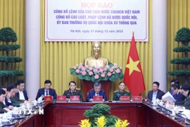 Quang cảnh Họp báo Công bố Lệnh của Chủ tịch nước Cộng hòa xã hội chủ nghĩa Việt Nam công bố các luật, pháp lệnh đã được Quốc hội, Ủy ban Thường vụ Quốc hội khóa XV thông qua. (Ảnh: An Đăng/TTXVN)