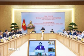 Thủ tướng Phạm Minh Chính chủ trì Hội nghị tham vấn các chuyên gia, tổ chức trong nước và quốc tế về thành lập Trung tâm tài chính quốc tế tại Việt Nam. (Ảnh: Dương Giang/TTXVN)