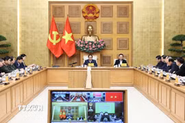 Thủ tướng Phạm Minh Chính chủ trì cuộc họp về xây dựng nhà cho nhân dân bị thiệt hại do bão lũ. (Ảnh: Dương Giang/TTXVN)