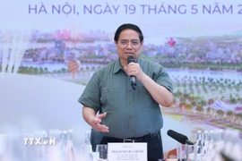 Thủ tướng Phạm Minh Chính làm việc với các bộ, ngành, nhà đầu tư và đơn vị thi công dự án Trung tâm Hội chợ Triển lãm Quốc gia. (Ảnh: Dương Giang/TTXVN)