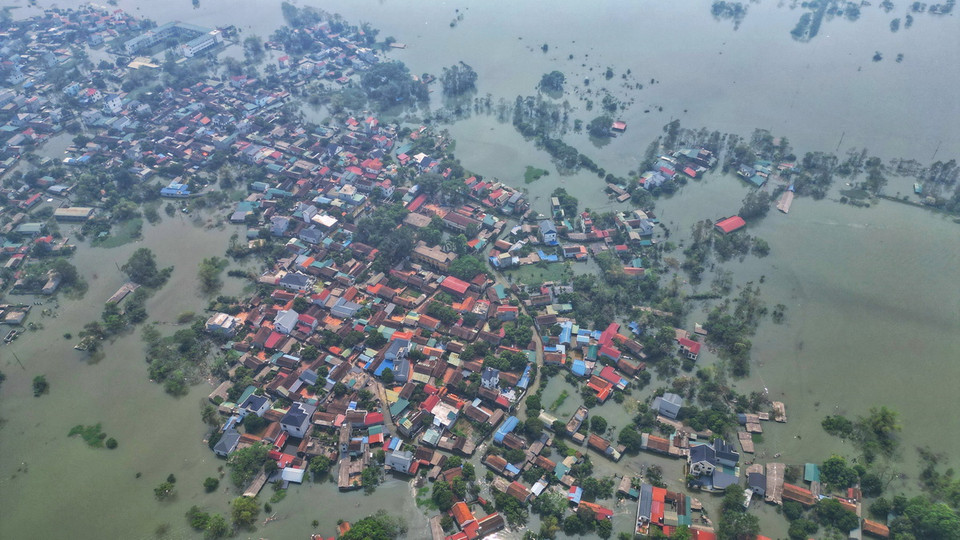 Xã Nam Phương Tiến có 4 thôn với tổng số 875 hộ bị ngập (ảnh chụp sáng 15/9). (Ảnh: Tuấn Anh/TTXVN)