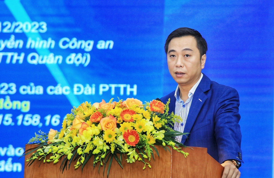 Phó Giám đốc Trung tâm Truyền hình Thông tấn Nguyễn Quang Vũ trình bày tham luận. (Ảnh: Tuấn Anh/TTXVN)