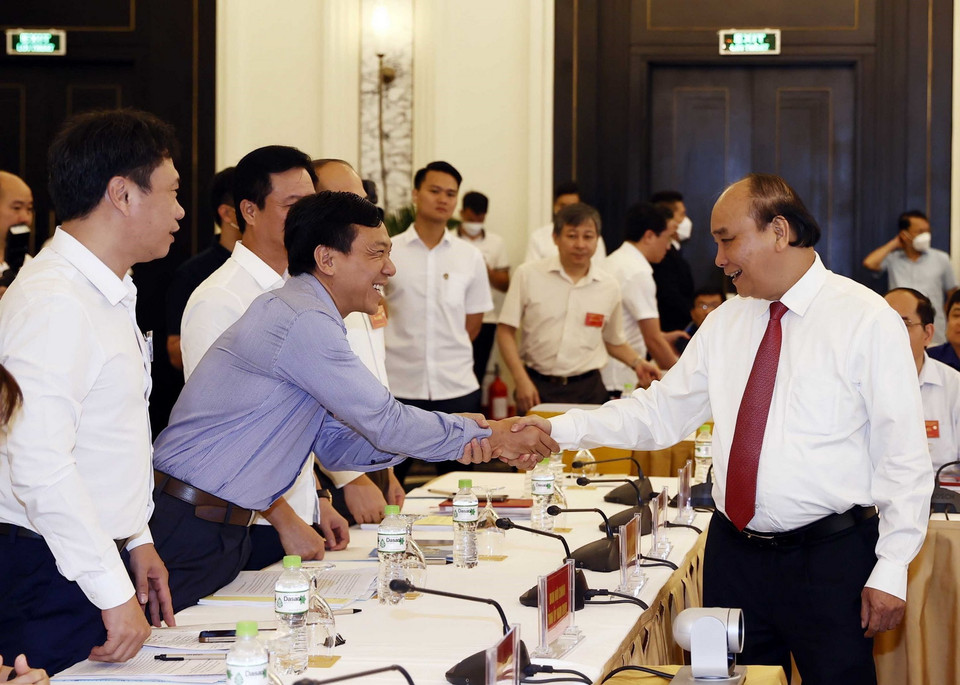 Chủ tịch nước Nguyễn Xuân Phúc và các đại biểu tại hội nghị. (Ảnh: Thống Nhất/TTXVN)